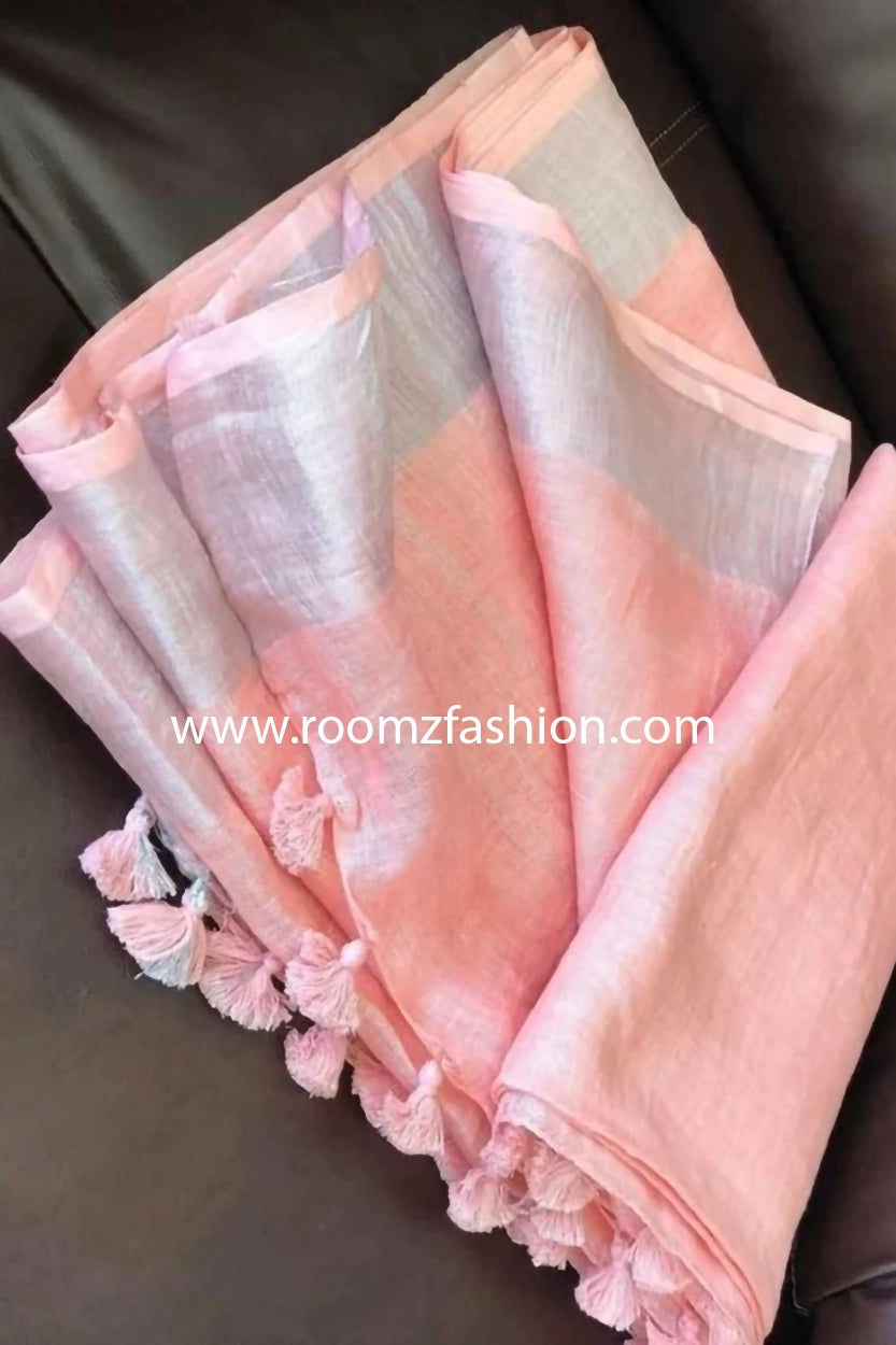 Close-up of silver zari wave pallu on pink linen saree