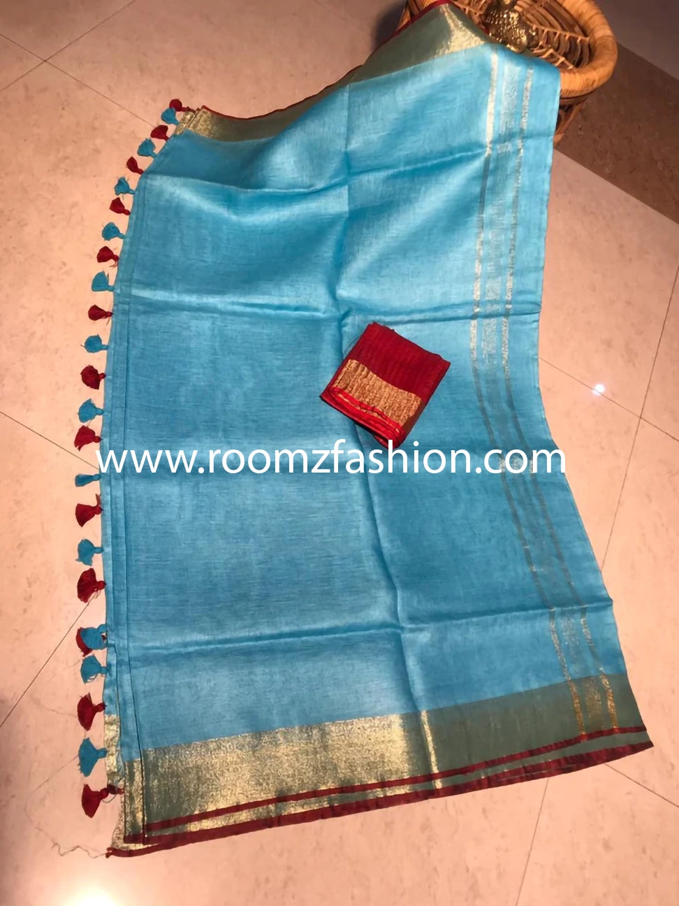 Turquoise pure linen saree with golden zari border and red piping - Roomz