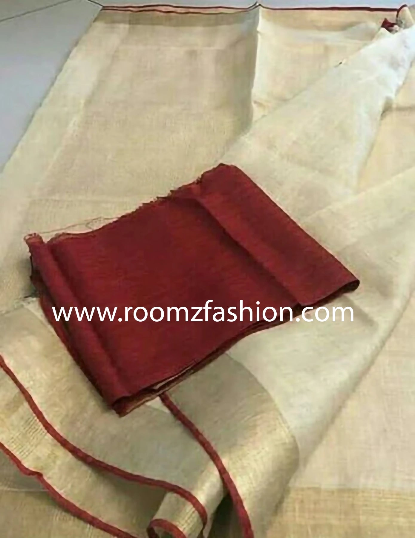 Off-white linen saree with golden zari border and red piping - Roomz Ethnic Collection