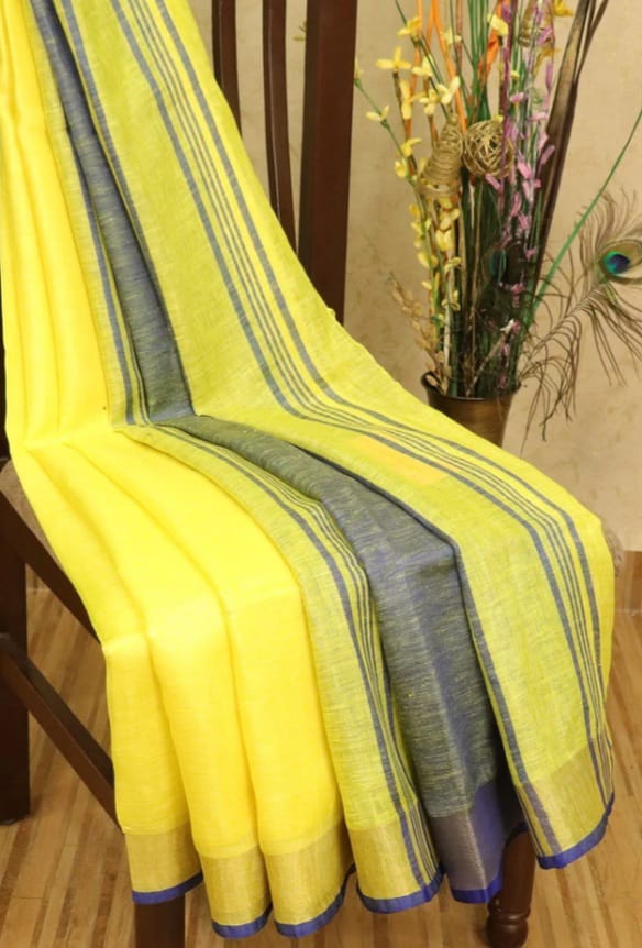 Yellow linen saree with silver zari border and blue piping - Roomz Festive Collection
