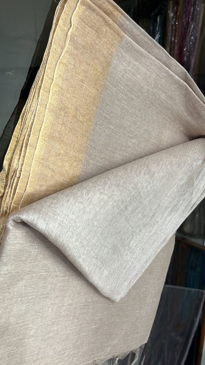 "Khaki silk linen handloom saree with zari pallu – elegant pastel wedding wear for women, featuring a soft, breathable texture and traditional craftsmanship."