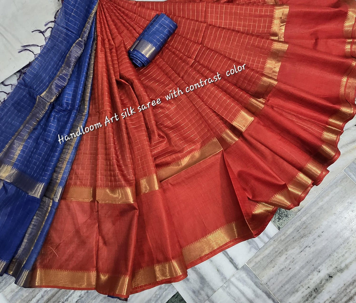 Orange-blue dual-tone silk saree with golden border draped elegantly