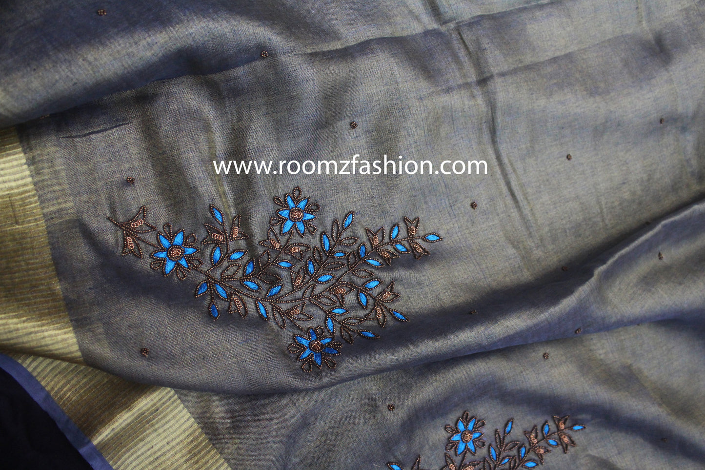 Artisan handwork detail on gray saree