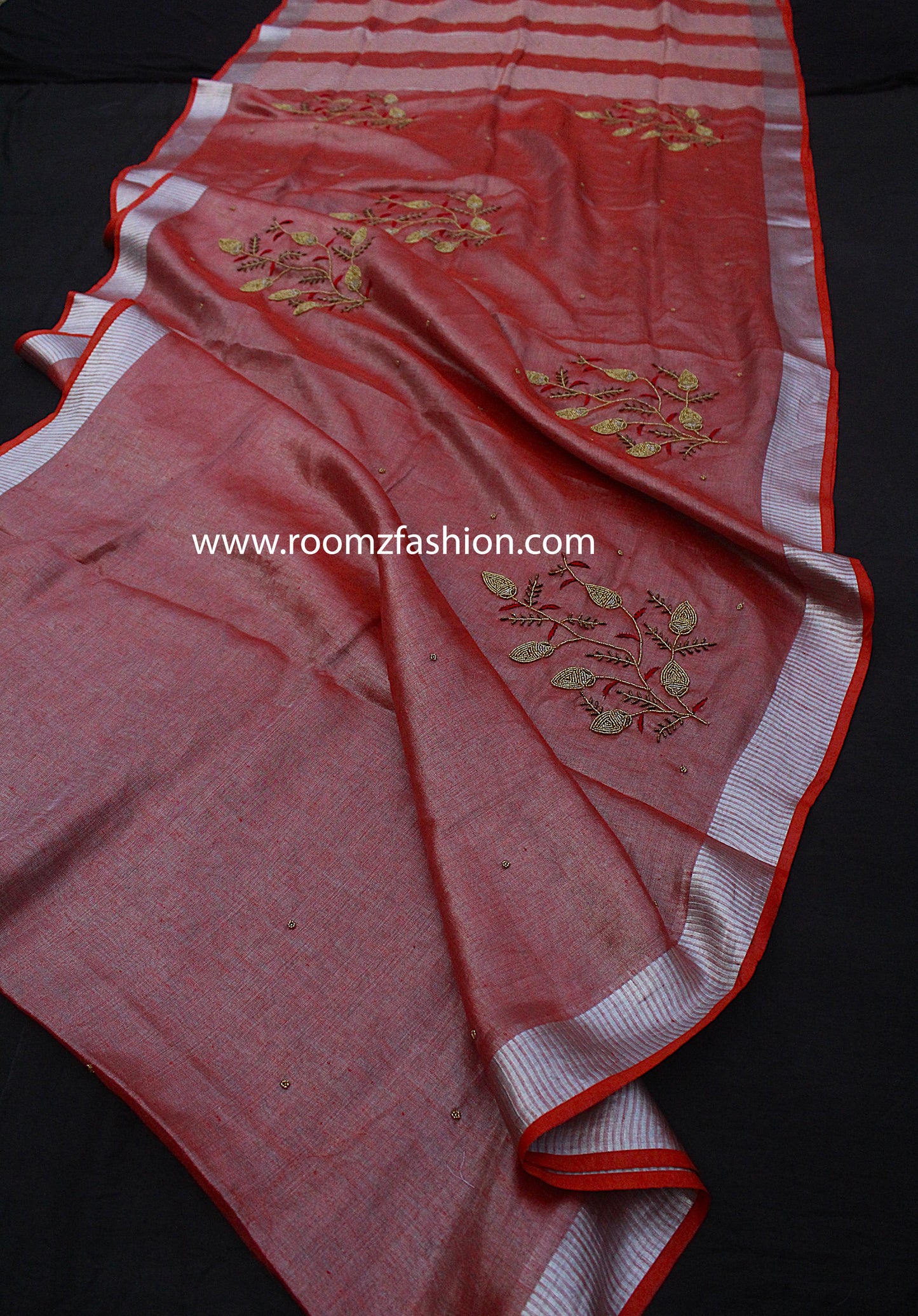Detailed view of hand embroidery on tissue linen saree - Roomz