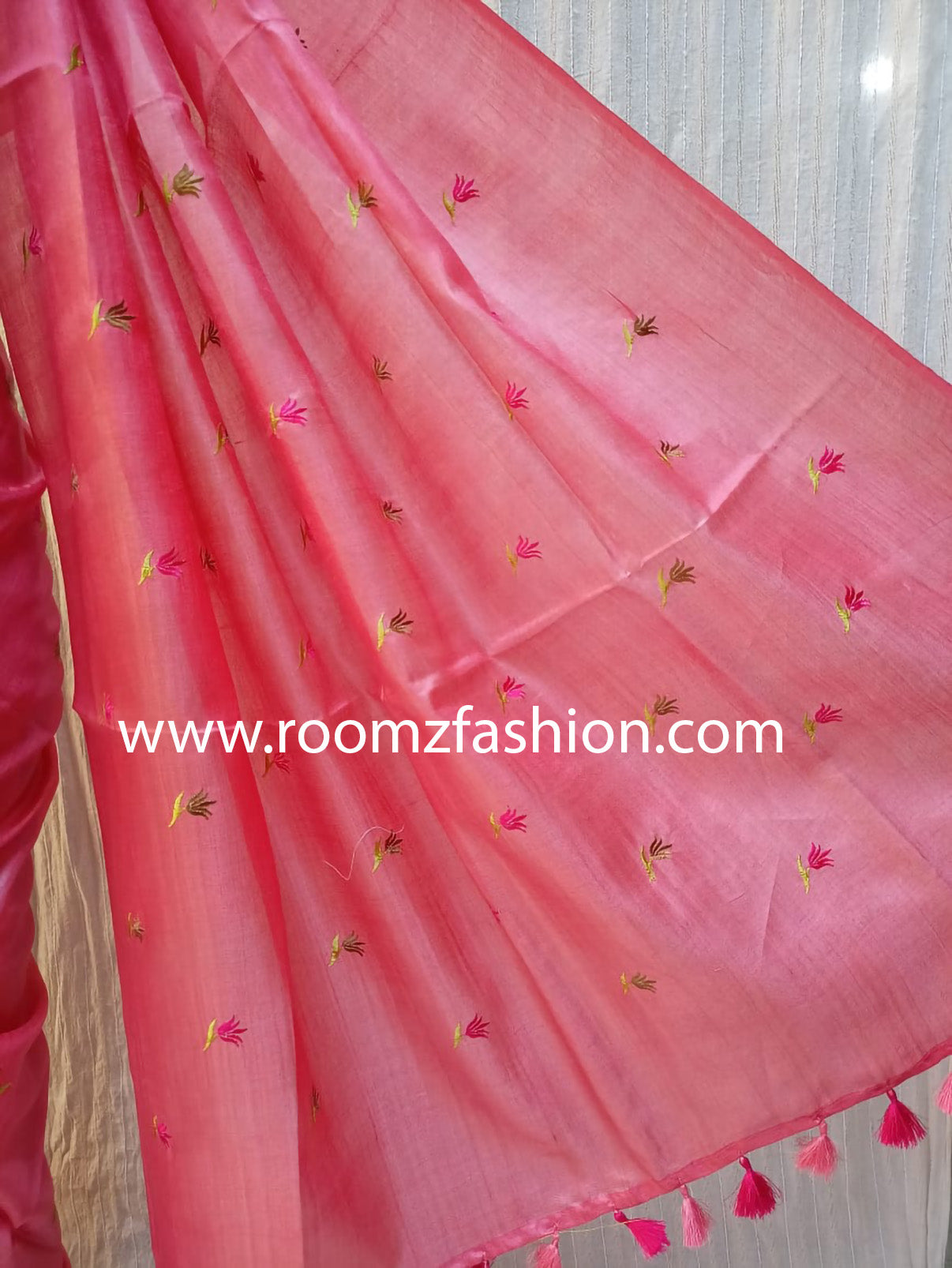 Close-up of handloom texture on orange Tussar silk