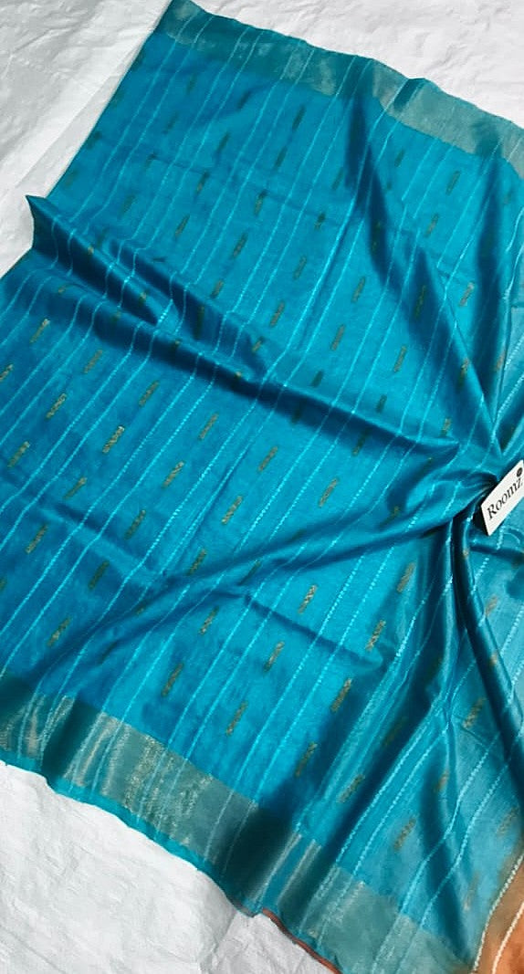 Close-up of Dobi weaving texture on turquoise Organza Viscose saree - Roomz Fashion