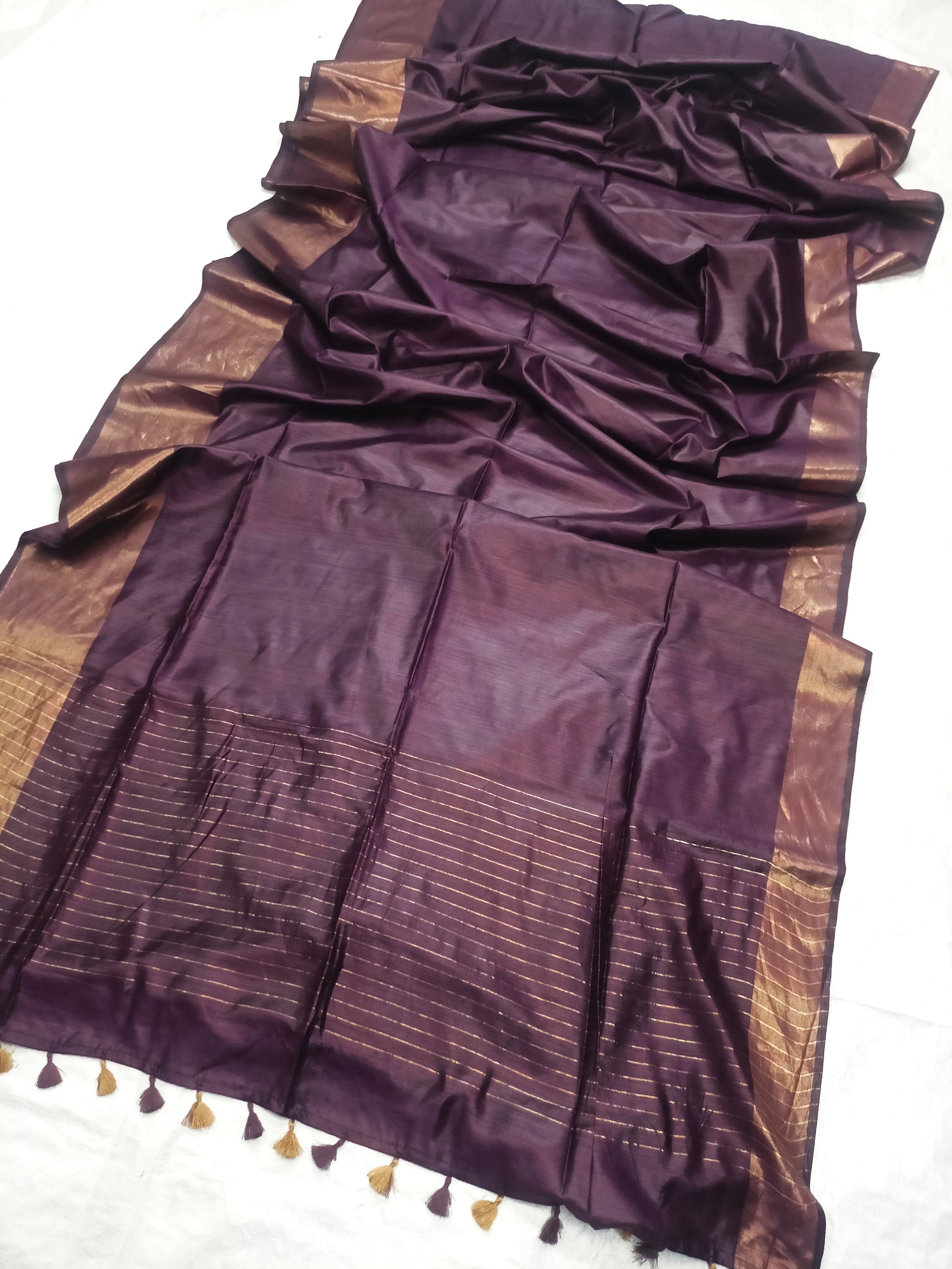 Close-up of Tussar Munga silk texture on wine color saree - Roomz Fashion