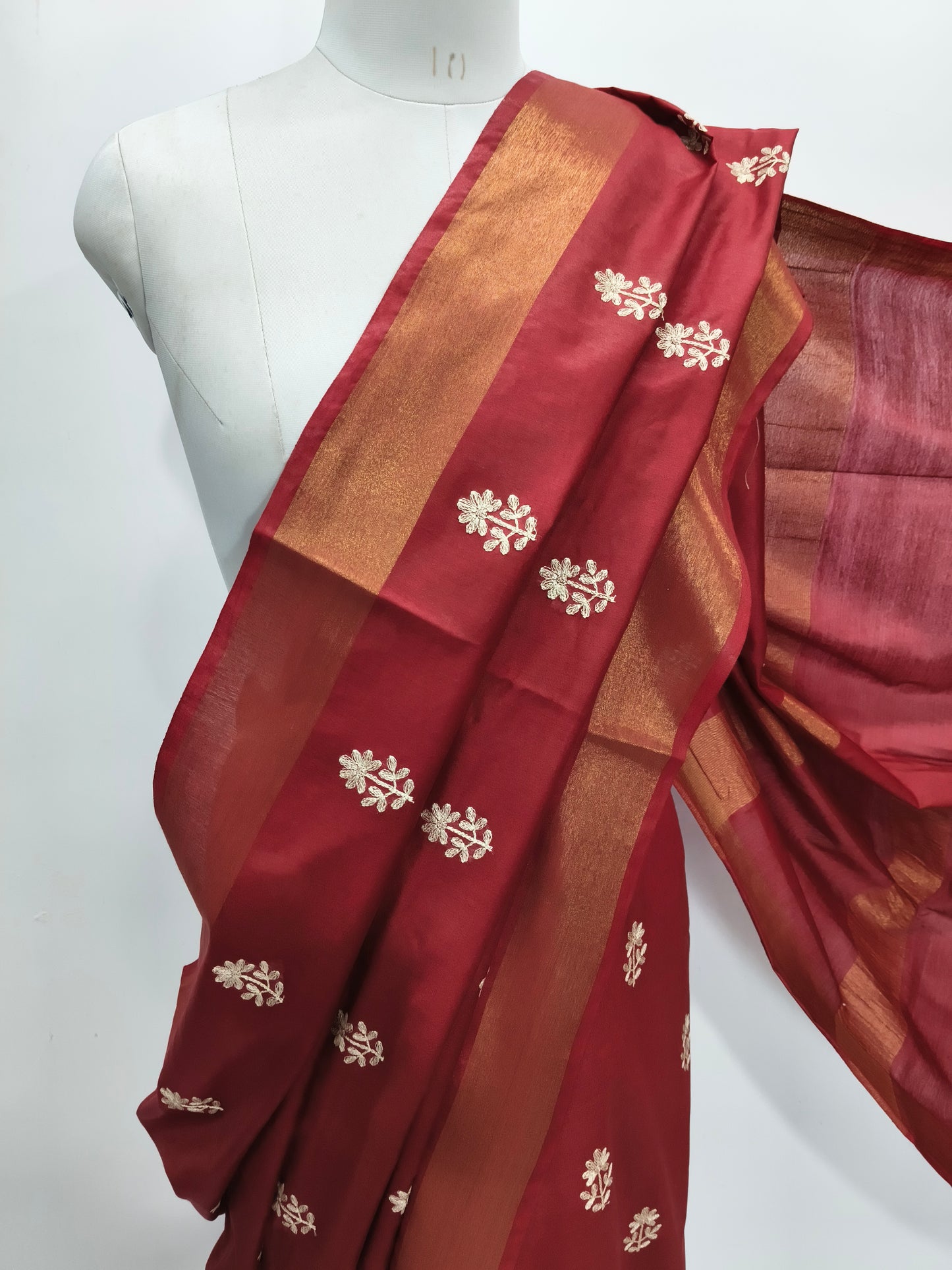 Close-up of embroidery detail on maroon Kota Viscose saree - Roomz Fashion