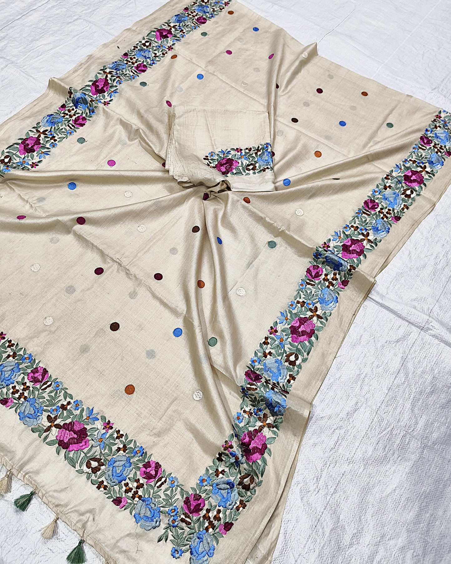 Close-up of embroidery detail on off-white Tussar silk saree - Roomz Fashion