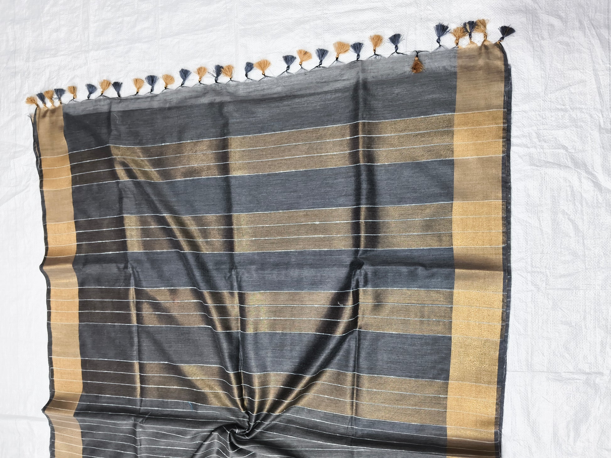 Close-up of weaving texture on black Organza Viscose saree - Roomz Fashion