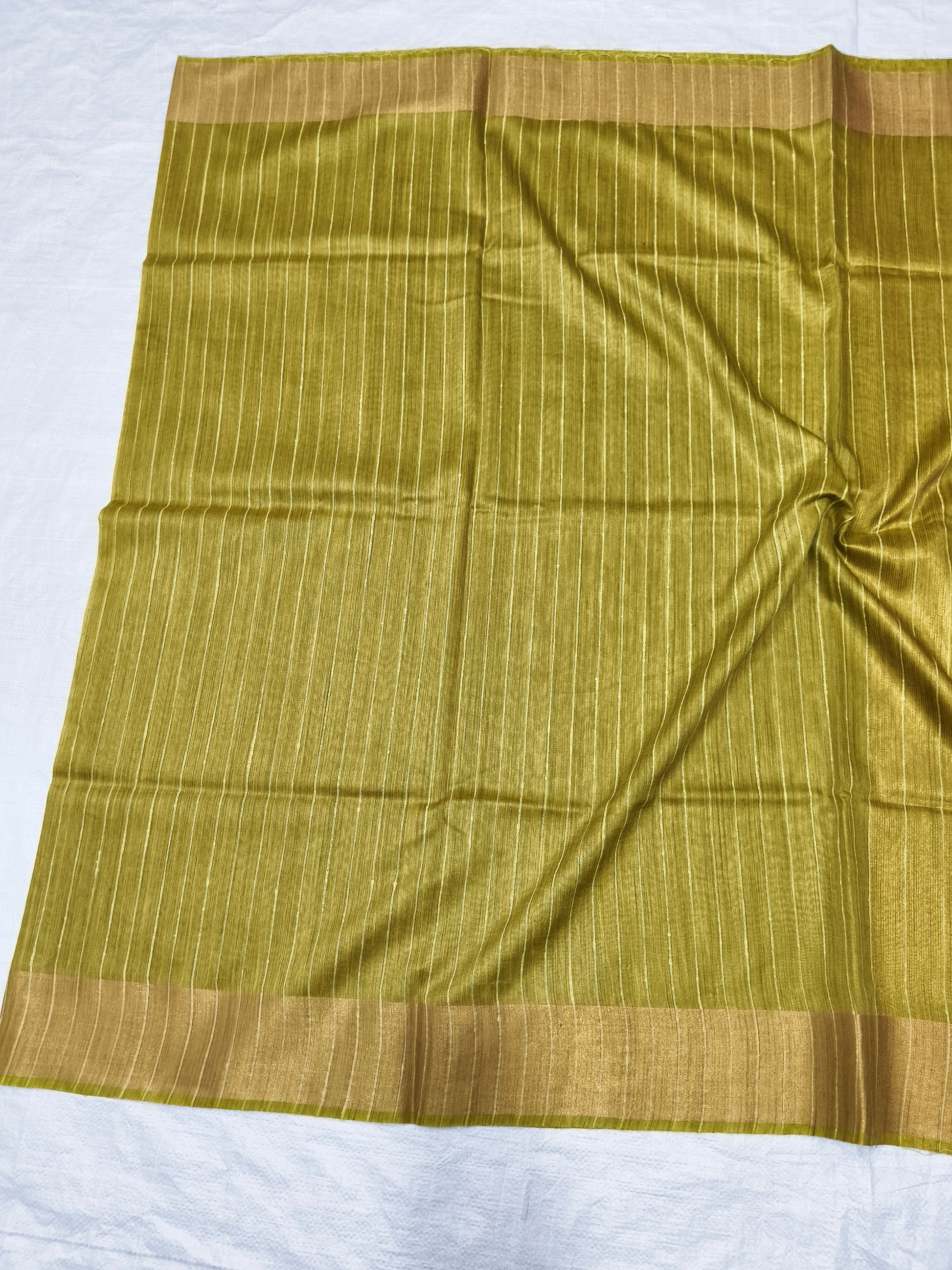 Draped lemon yellow Organza Viscose saree showing elegant fall - Roomz Collection