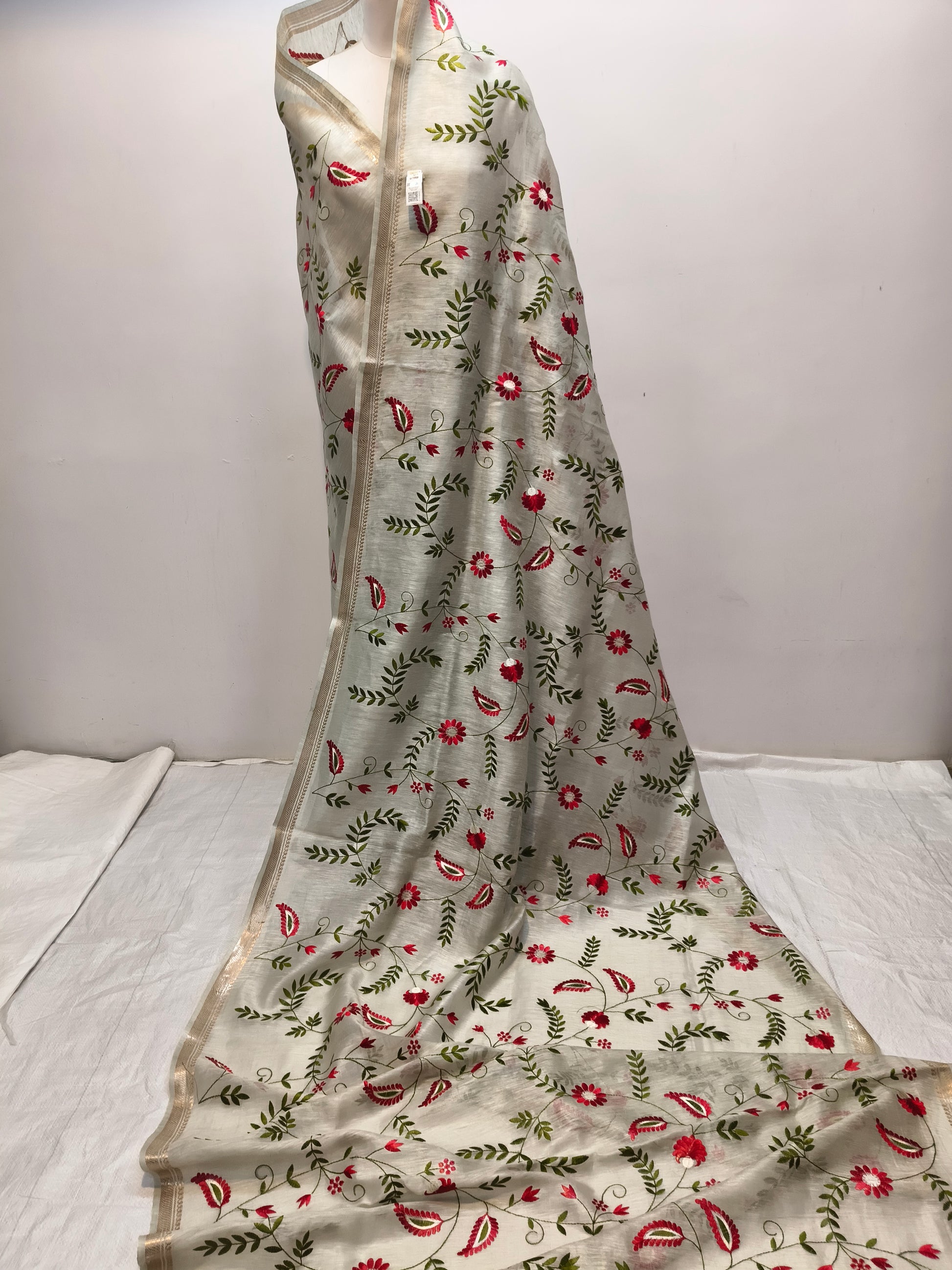 Draped light green silk linen saree showing elegant fall - Roomz Collection