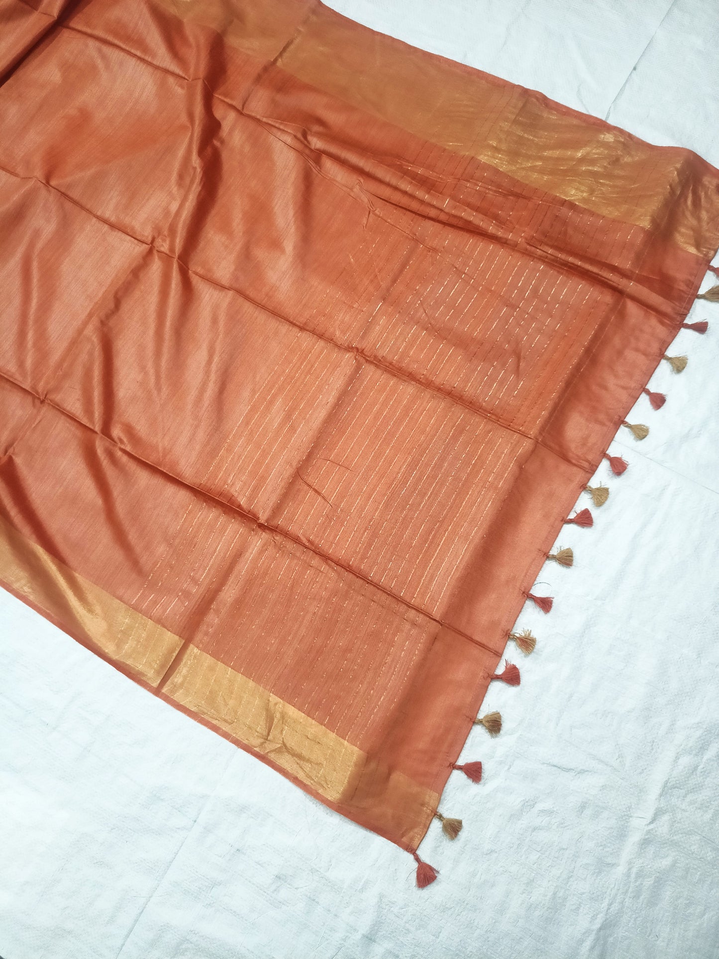 Draped peach Tussar silk saree showing elegant fall - Roomz Collection