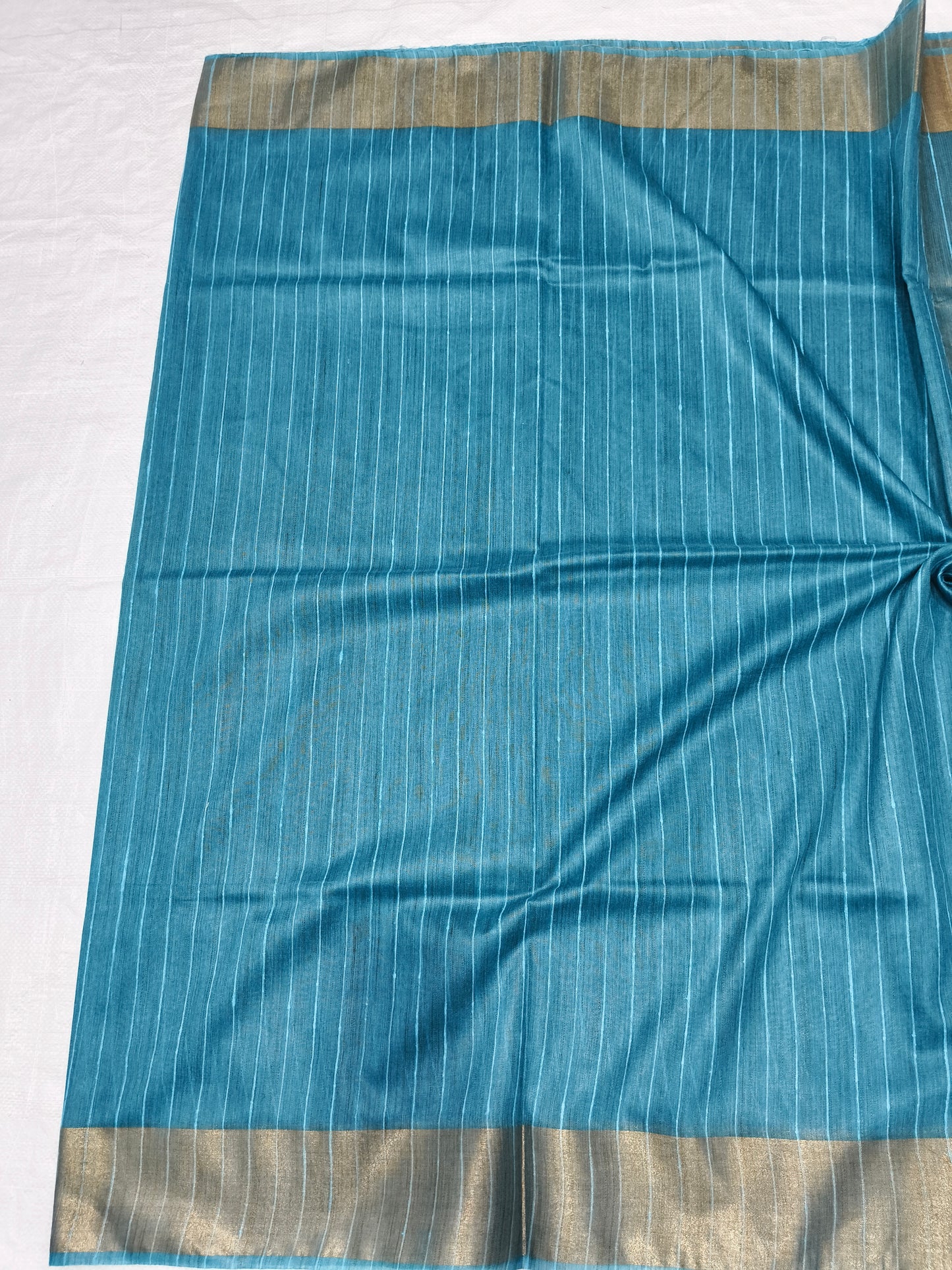 Draped turquoise Organza Viscose saree showing elegant fall - Roomz Collection