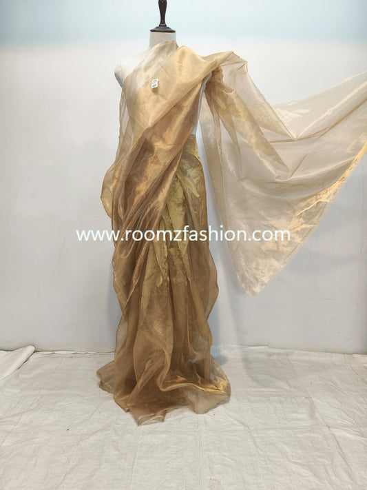 Glassy golden tissue silk saree with plain design
