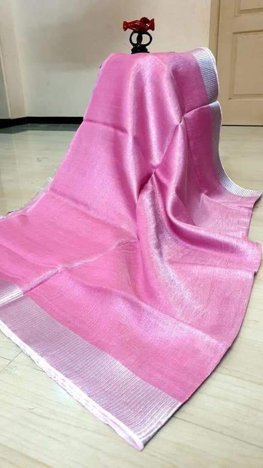 Pink tissue linen saree with silver zari border draped elegantly