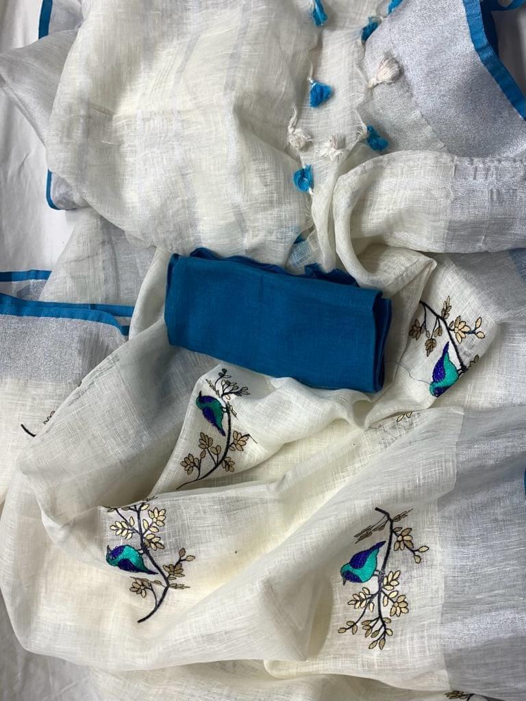 White linen saree with silver zari border and turquoise piping - Roomz Bridal Collection