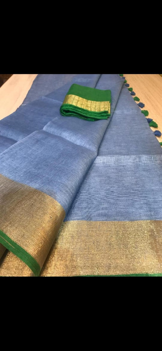 Steel blue linen saree with golden zari border and green piping - Roomz Luxury Collection
