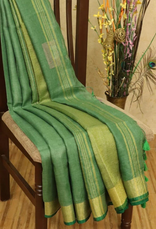Green linen saree with golden zari border - Roomz Luxury Collection