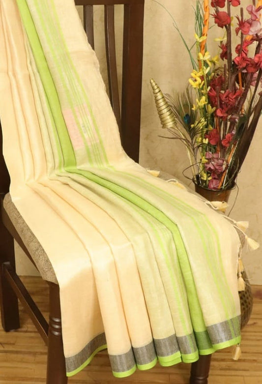 Off-white linen saree with silver zari border and parrot green piping - Roomz Luxury Collection