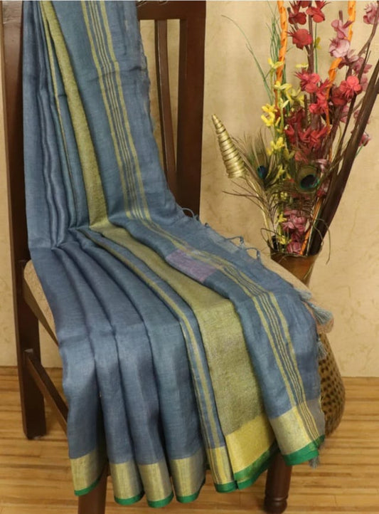 Gray linen saree with golden zari border and green piping - Roomz Luxury Collection