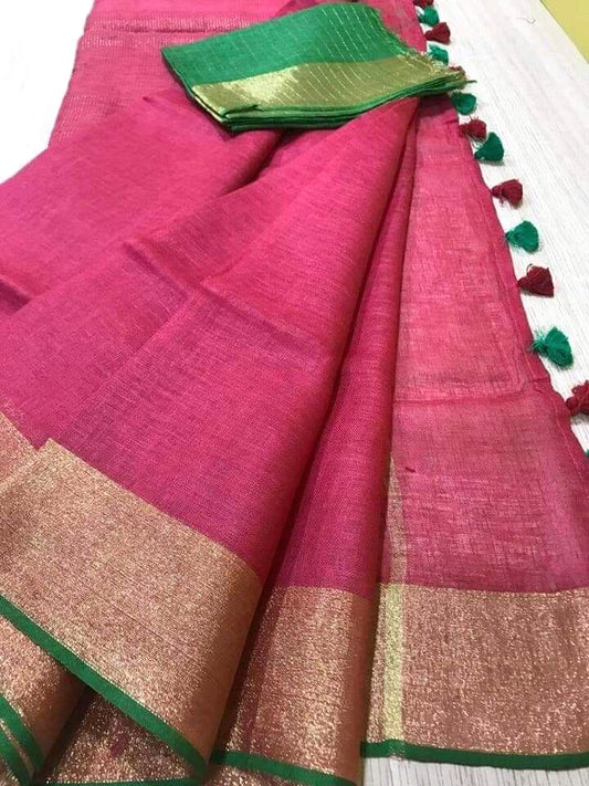 Pink linen saree with golden zari border and green piping - Roomz Festive Collection