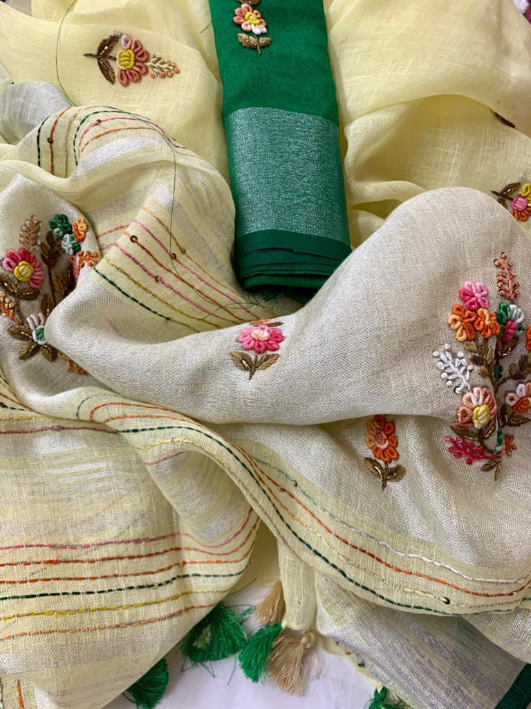 Hand embroidery detail on off-white saree