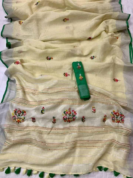 Off-white linen saree with silver border and green piping draped elegantly