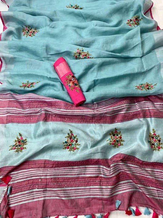 Blue-grey linen saree with silver-zari border draped elegantly