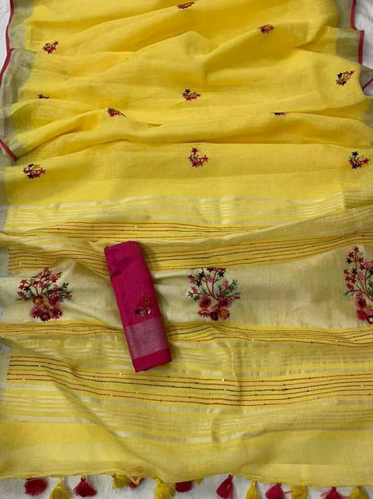 Peach linen saree with silver-zari border and hand embroidery draped elegantly
