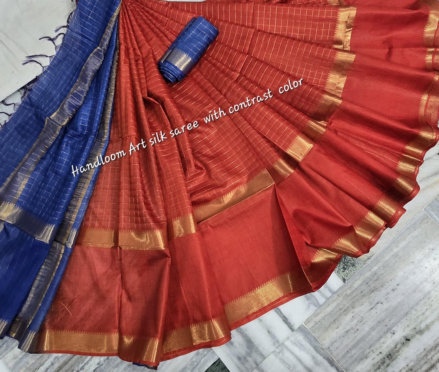Orange-blue dual-tone silk saree with golden border draped elegantly