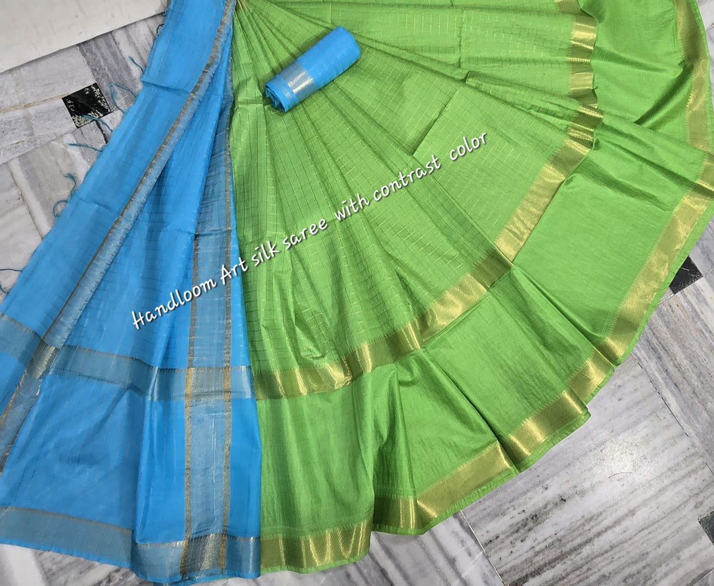 Green-turquoise dual-tone silk saree with golden border draped elegantly