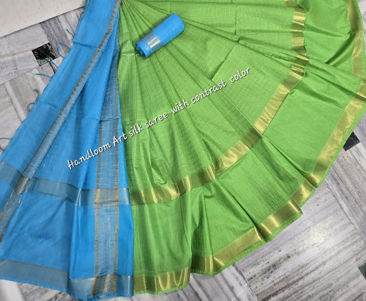 Green-turquoise dual-tone silk saree with golden border draped elegantly