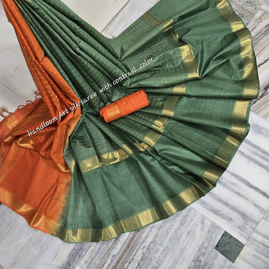Green-orange dual-tone soft silk saree with golden border draped elegantly