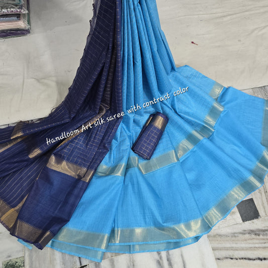 Turquoise-blue dual-tone silk saree with golden border draped elegantly