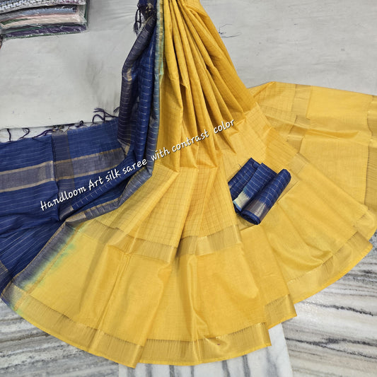 Yellow-blue dual-tone silk saree with golden border draped elegantly