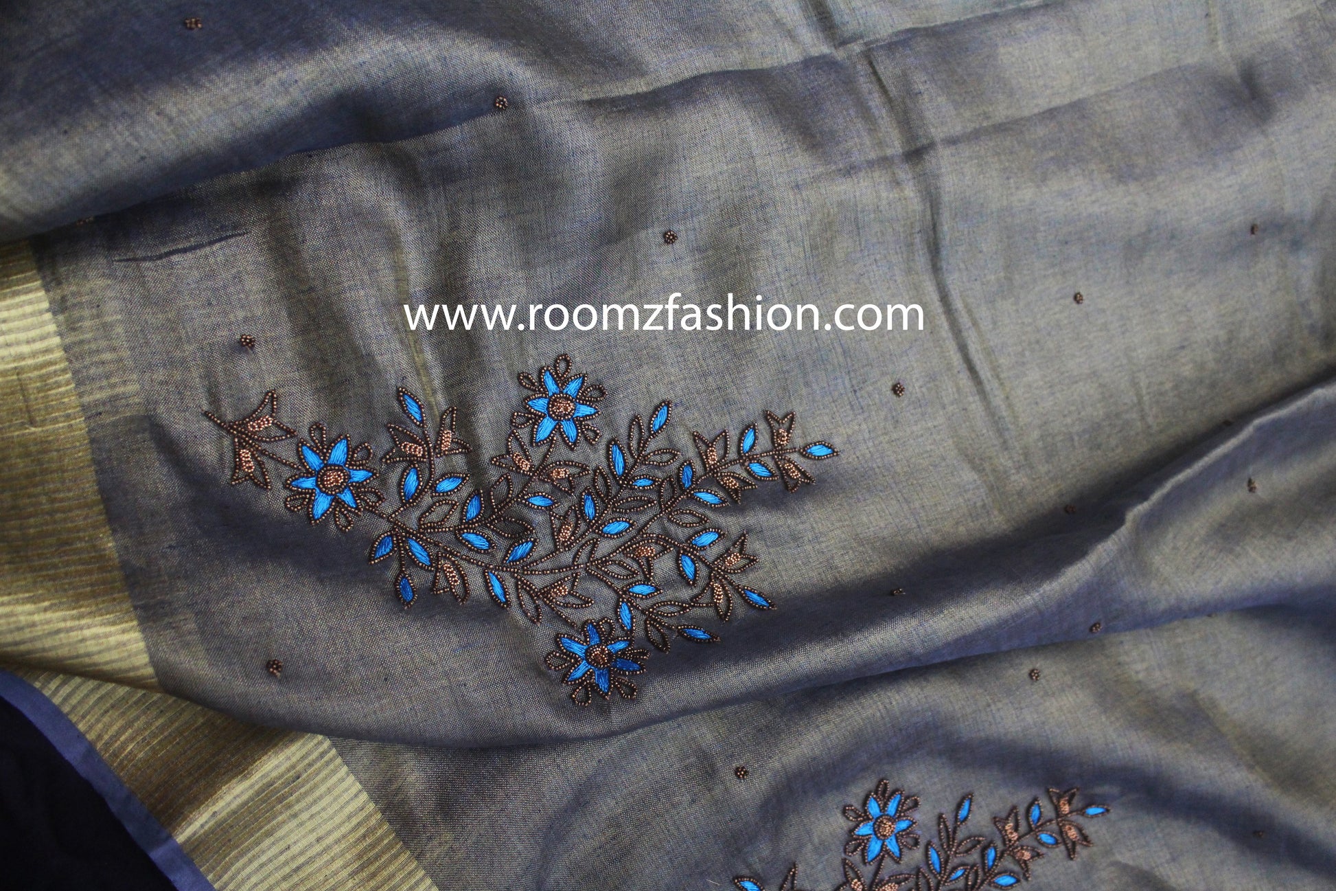 Artisan handwork detail on gray saree