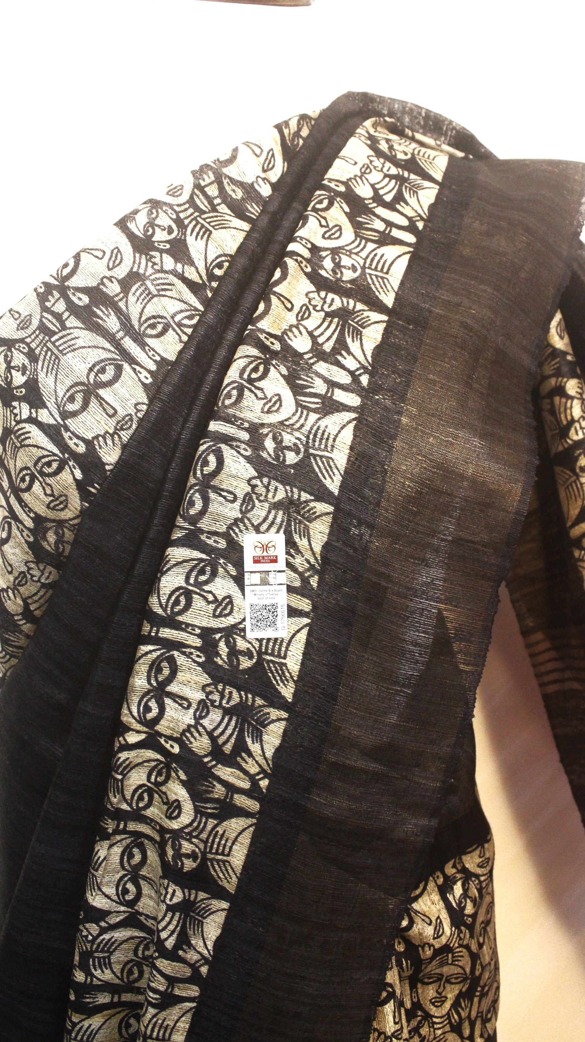 "Close-up of Madhubani art prints on Tussar Ghicha silk saree pallu"