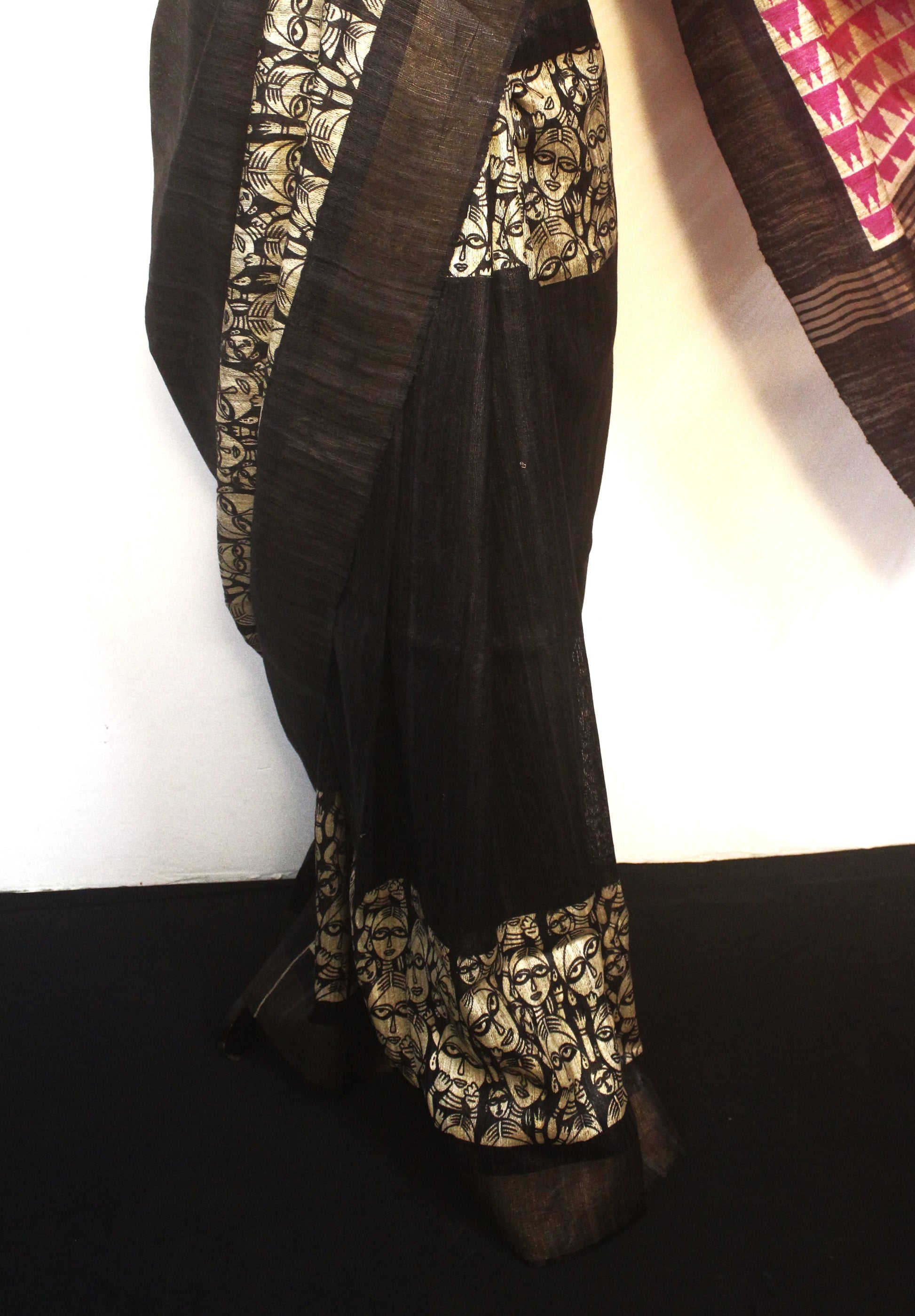 Draped Madhubani art silk saree showing golden zari border details"