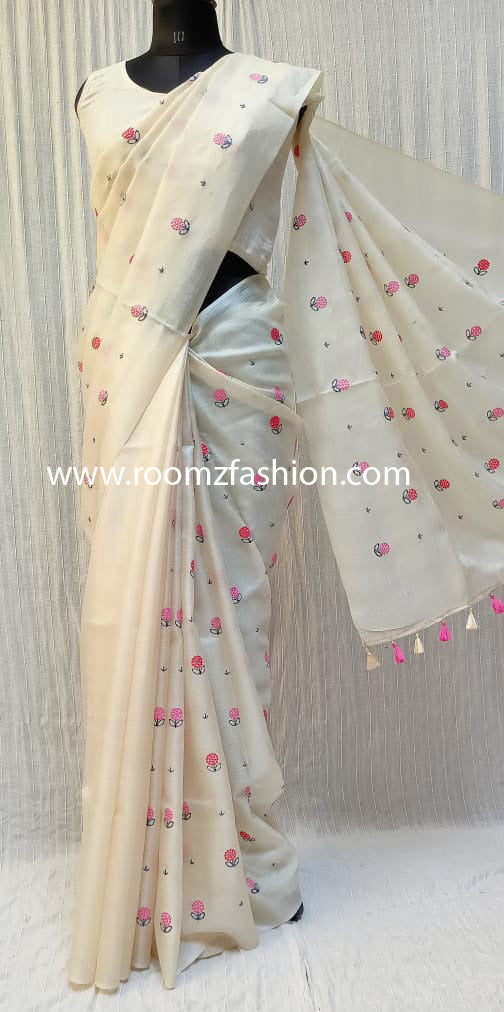 Hand-stitched floral embroidery detail on off-white saree