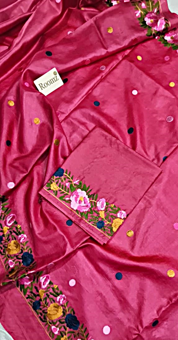 Bright pink silk saree with matching embroidered blouse piece